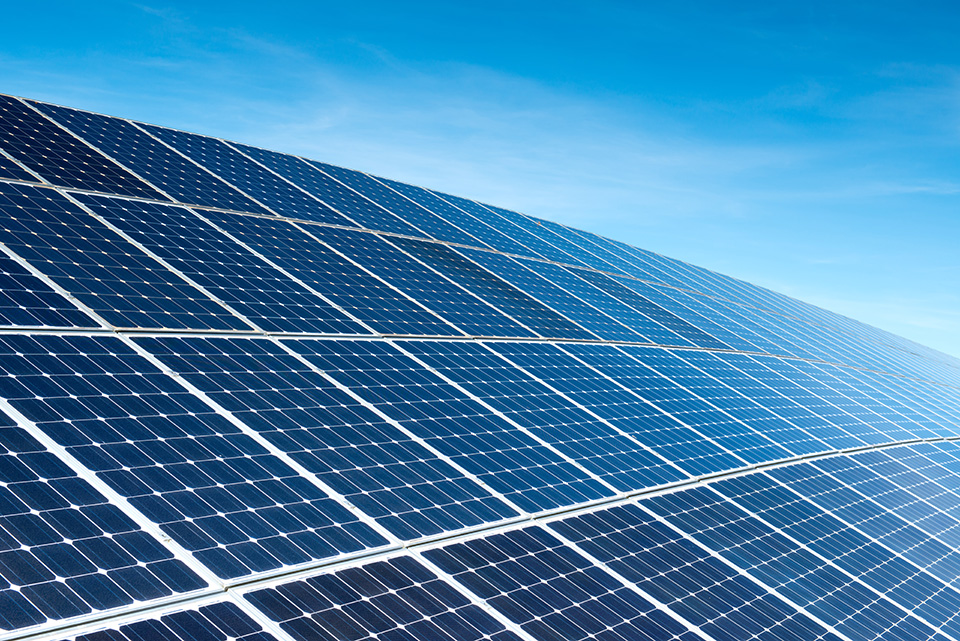 Solar panels reflect in the sunlight.