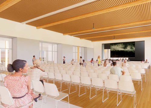 A rendering shows an outdoor terrace that has multiple functions. It extends from the Community Room towards the outdoors. Currently, tables and seating are set up in the space.