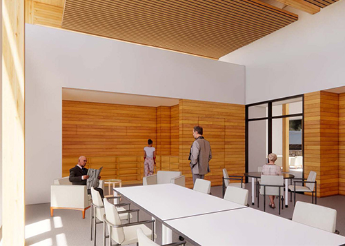 A rendering shows an outdoor terrace that has multiple functions. It extends from the Community Room towards the outdoors. Currently, tables and seating are set up in the space.